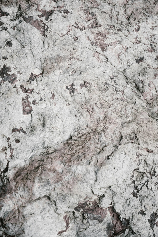 Close-up texture of grey and pink stone, photo by Annie Spratt