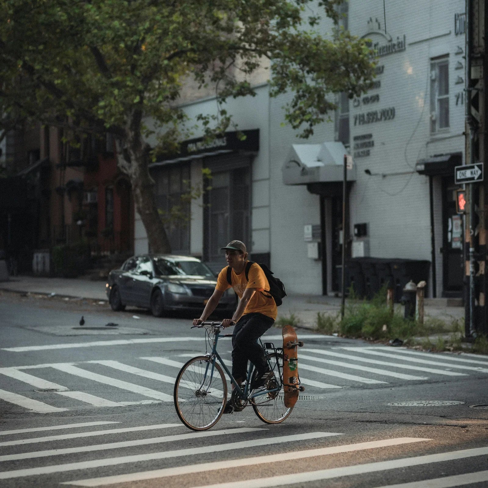 Cyclist crossing a zebra crossing on a city street, photo by Lerone Pieters