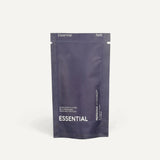 Essential refill pouch standing on a cream background
